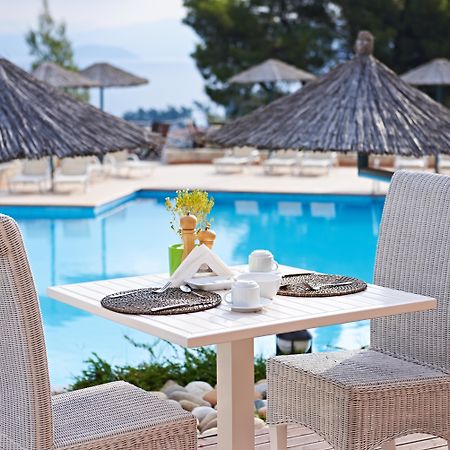 Alia Palace Hotel - Adults Only 16+ Chalkidiki Ngoại thất bức ảnh A poolside table at a hotel