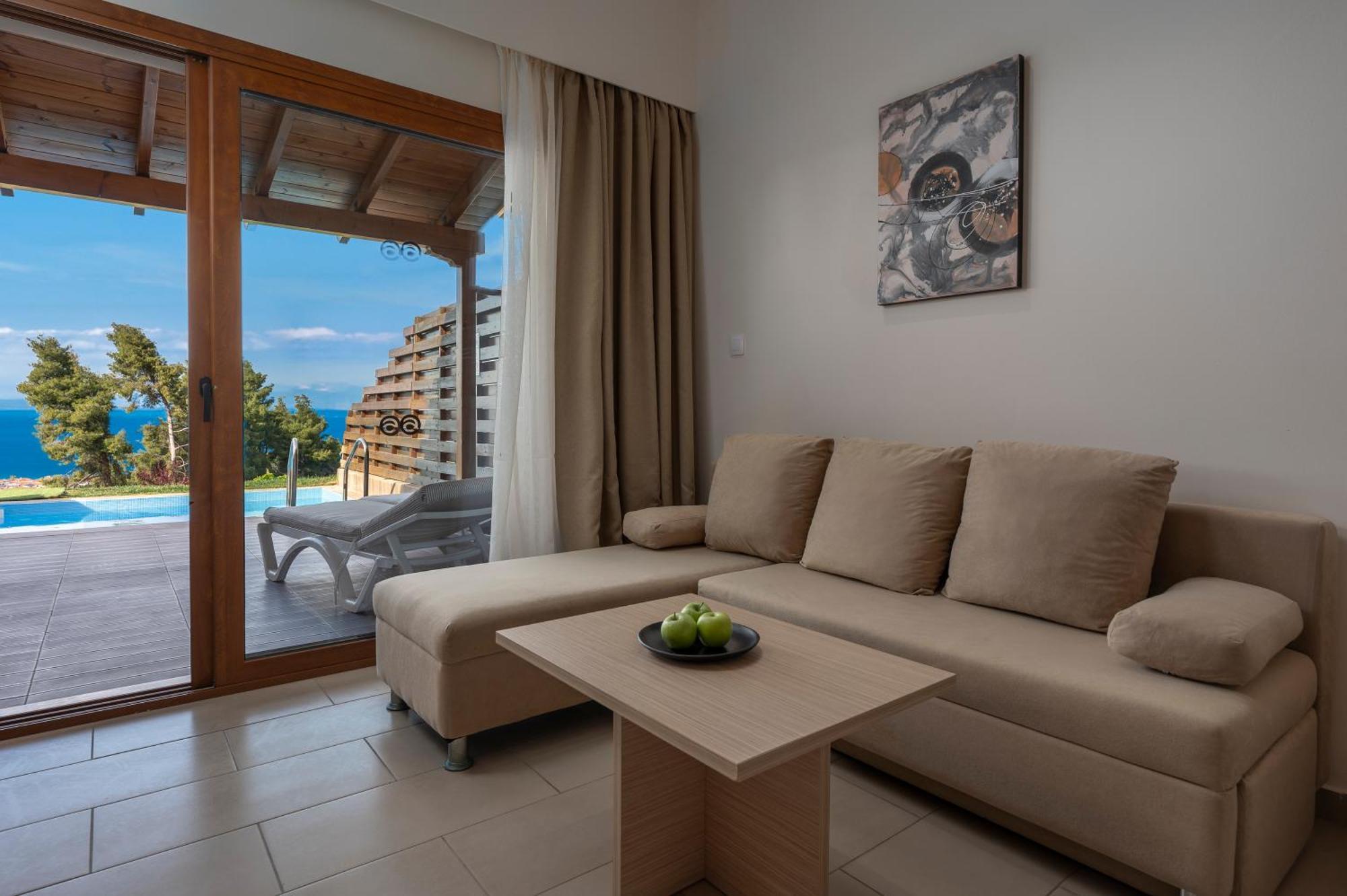 Alia Palace Hotel - Adults Only 16+ Chalkidiki Ngoại thất bức ảnh A living room with a sofa
