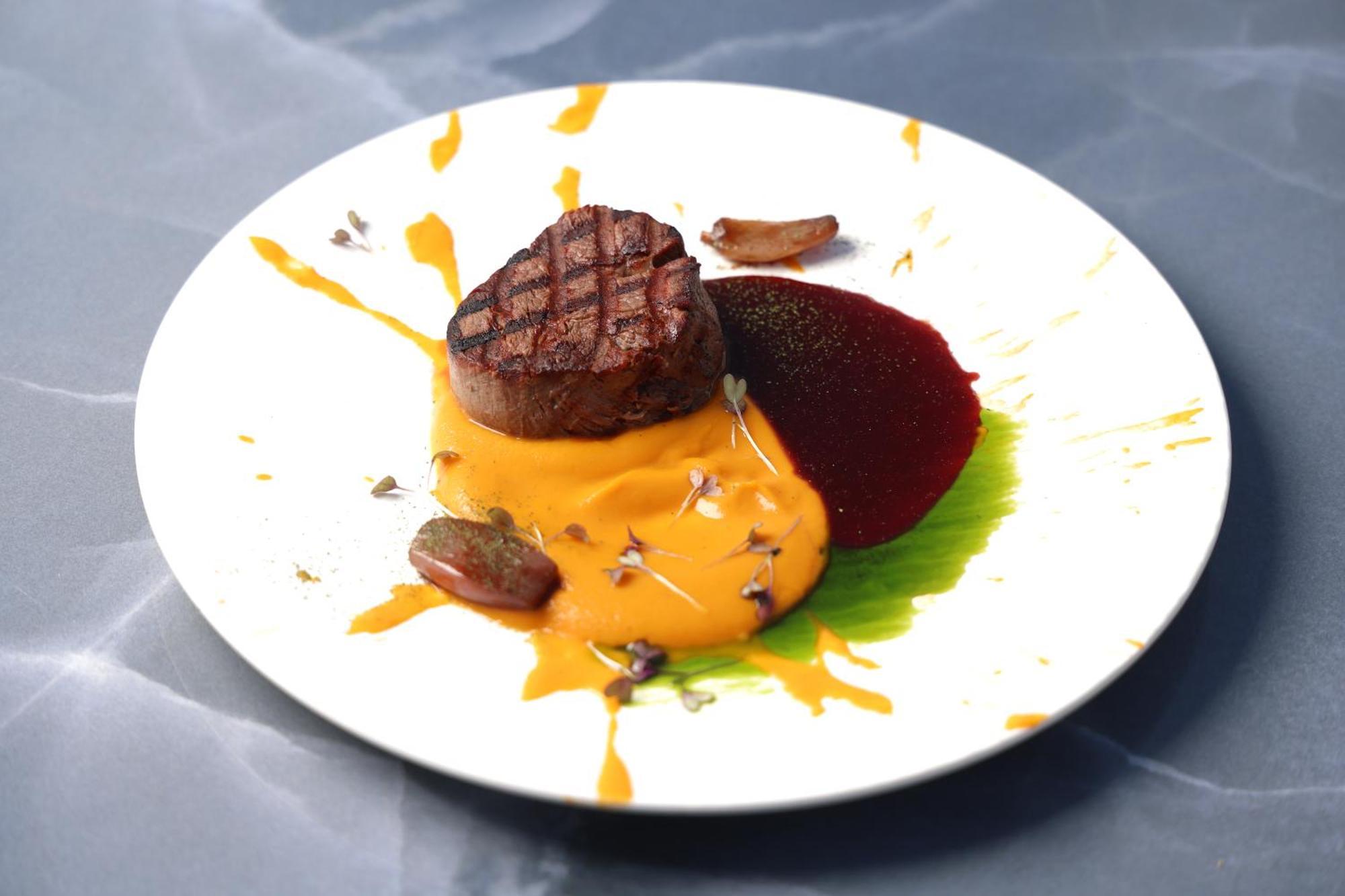 Alia Palace Hotel - Adults Only 16+ Chalkidiki Ngoại thất bức ảnh A steak with a pumpkin sauce