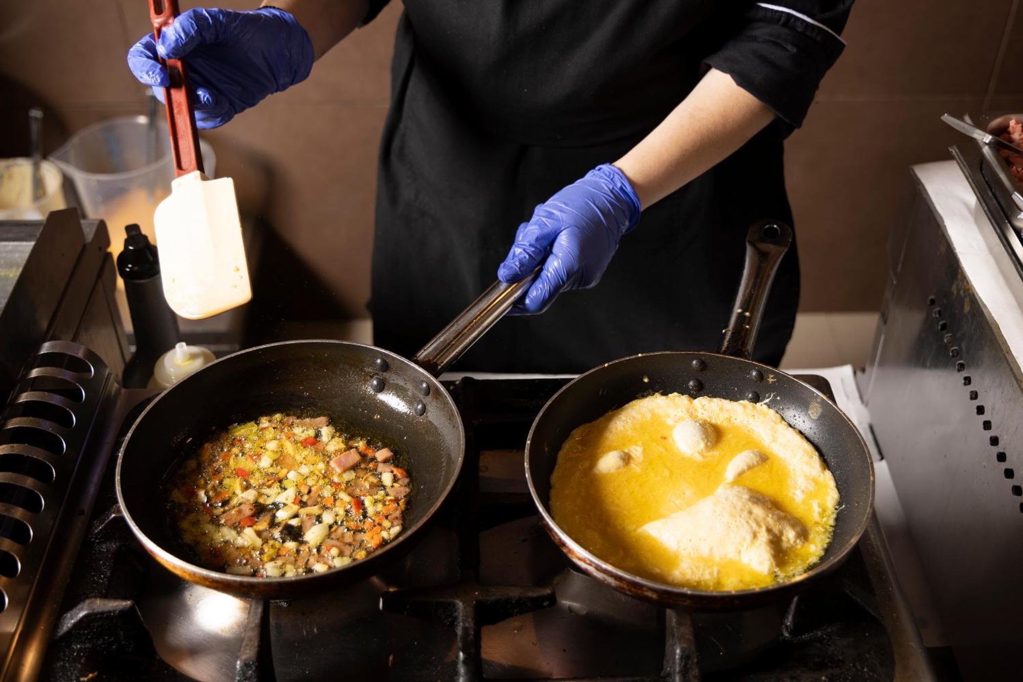 Alia Palace Hotel - Adults Only 16+ Chalkidiki Ngoại thất bức ảnh A chef cooking with a wok